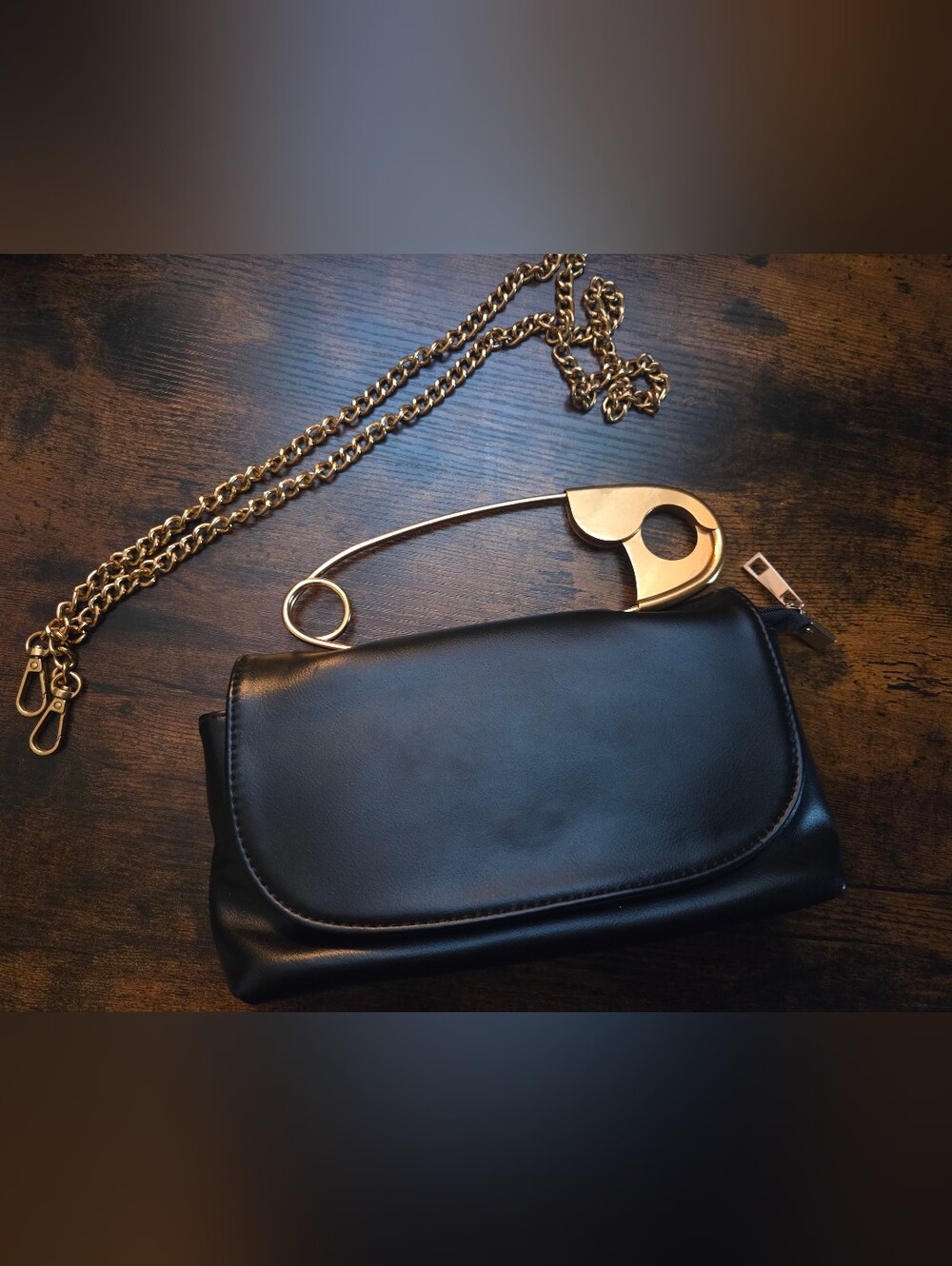 Black Clutch With Gold Safety Pin And Gold Chain